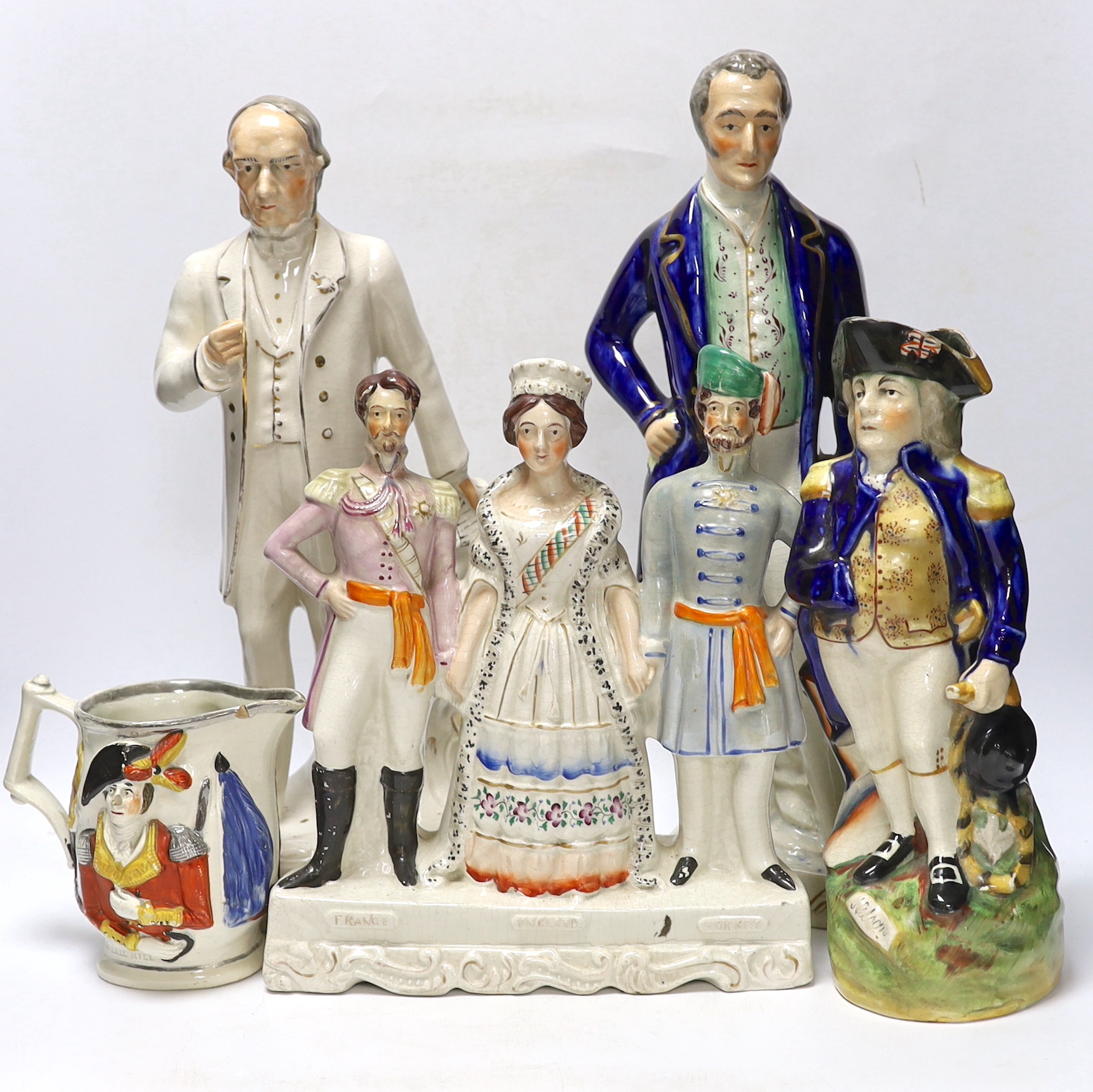 Military and Political Staffordshire figures - A Crimean war group of France, England and Turkey, a figure of Wellington as Prime Minister, a figure of Gladstone, a Nelson Toby jug and a General Hill/Marquis Wellington c